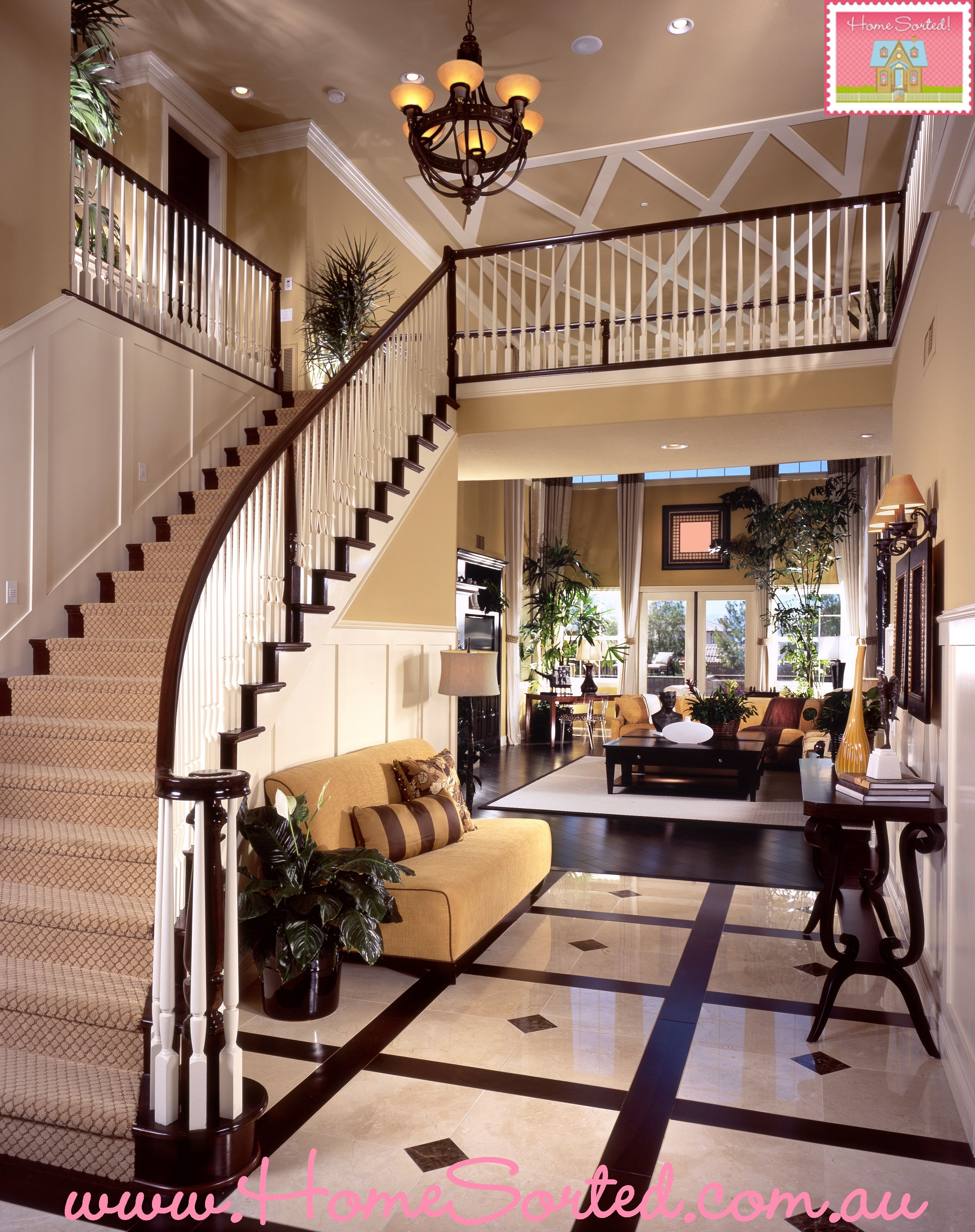 Куда холла. Гостиная с лестницей. Лестница в интерьере. Красивые интерьеры домов. Красивые гостиные с лестницей.